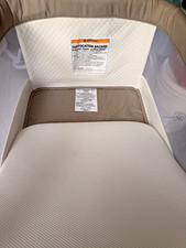 Delta Children Deluxe Glide Bassinet Beige/White Mesh Sides Storage Basket