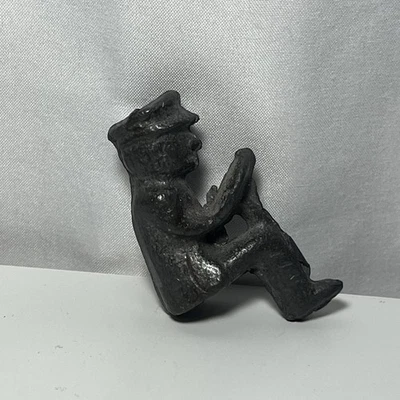 Antique Small Cast Man Holding Steering Wheel Figure from Kenton Cast Iron Toy - Image 1 of 4