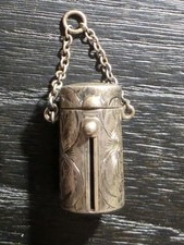 antique sterling silver case features an engraved Art Nouveau floral design...