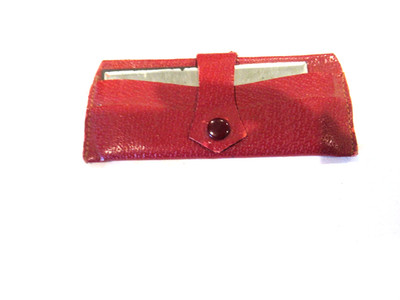 Purse mirror in red vinyl case, c. 1960s