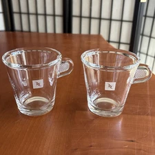 Two (2) Nespresso Clear Glass Espresso Cups with Pinch Handles - 3 Inches Tall