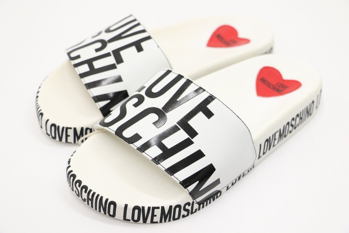Moschino ロコフリントストレッチフラ 251V6A08024410 0290 Love Moschino Sliders White and Black Logo Print Side Flip