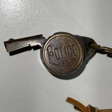 VINTAGE BRASS METAL WHISTLE POLICE WITH STAR ON SIDE & LEATHER STRAP/CORD