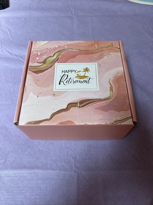 Retirement Gift Box For Women pink box, soap, coffee cup, towel and more.