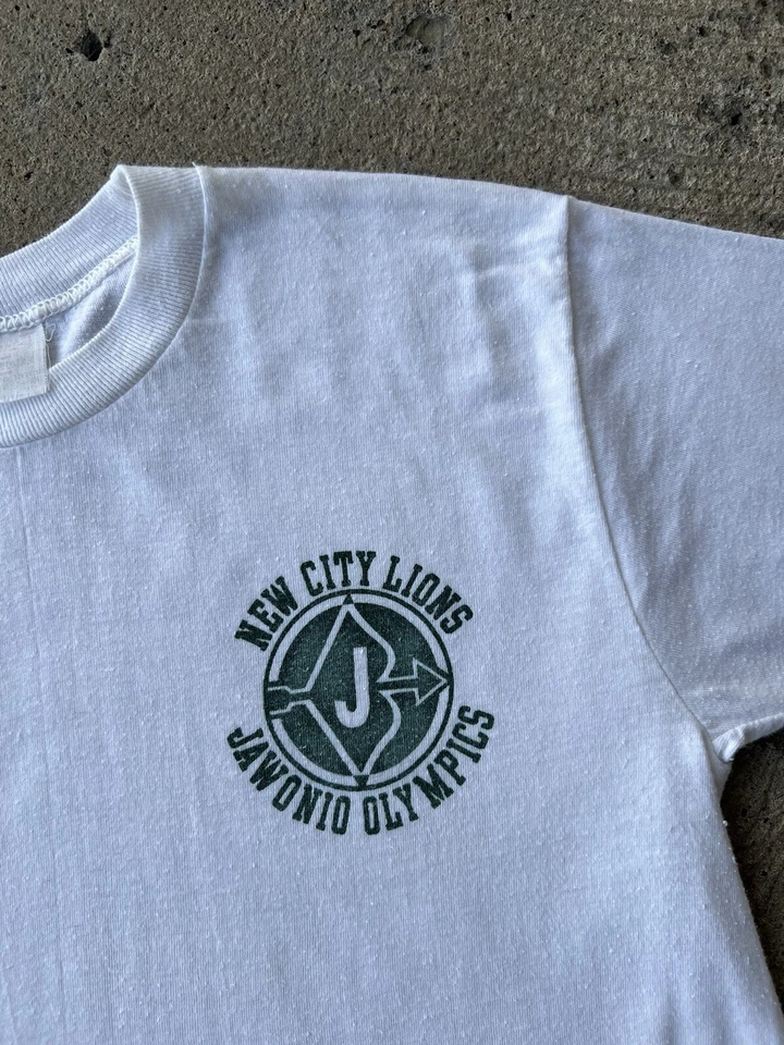 CAMISETA VINTAGE AÑOS 70 80 Jawonio Juegos Olímpicos Nueva Ciudad Leones Blanca Logotipo de Puntada Única Foto 2 de 4