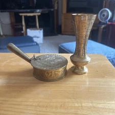 Two pieces of brass a vase and a popup ashtray excellent condition.