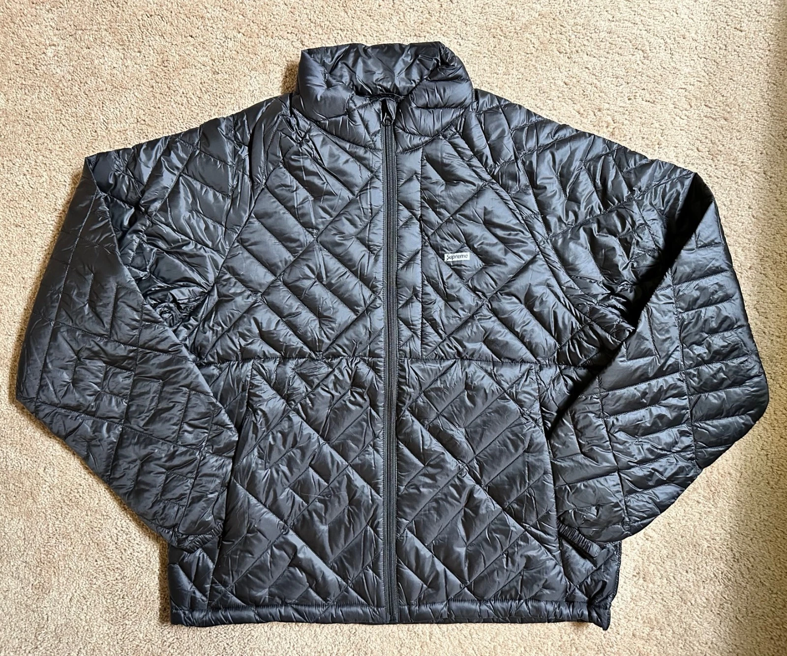 Veste en duvet légère matelassée Supreme Spellout taille moyenne noire NEUVE