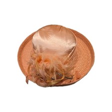formal peach/salmon pink wide-brim hat, specifically a designer piece by...