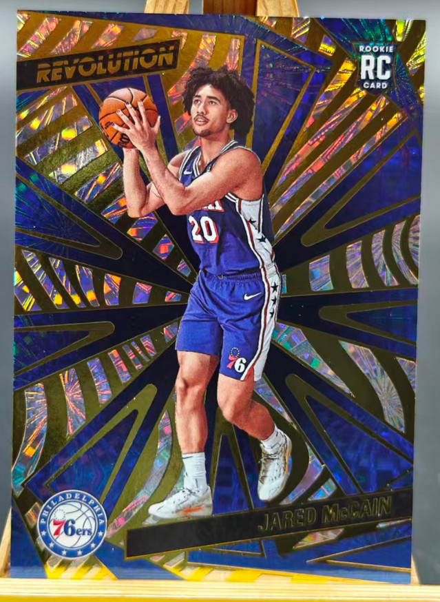 Jared McCain 2024-25 Panini Revolution 121/149 Fireworks Bronze RC 76ers #124