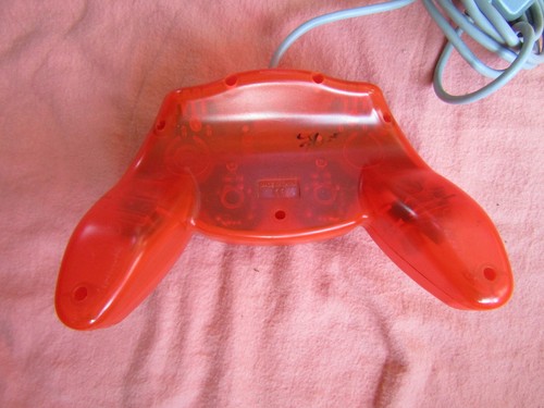 CONTROLADOR ANALÓGICO NARANJA TRANSPARENTE SIN MARCA PLUS DOBLE SACUDIDA PARA PS1 - Imagen 4 de 5