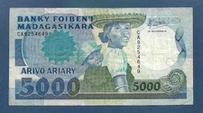 (DN) Madagascar 5000 Francs 1988 First Sign. P-73a Fine/VF