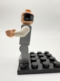 Lego  Lobot - Light Bluish Gray Uniform, Light Nougat Head, Black Eyebrows