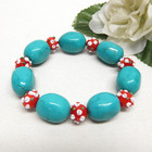 New ListingTurquoise Colored Stone & Floral Red Lampwork Art Glass Bead Bracelet