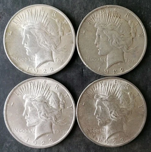 Two 1922 and Two 1923 $1 Peace Silver Dollars