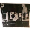 Photograph. FDR, Harry Truman, Henry Wallace in open car with FDR's dog Fala.