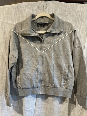 Gray Ruby Diva jacket with white piping around the front/embroidered Ruby Diva 