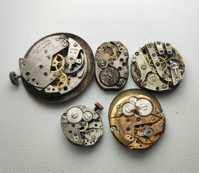 Watch lot movement for parts as 1012 aureus eb 1197 eta 761 and others rust