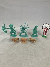 Collection of vintage plastic toy figures depicting Native American warriors