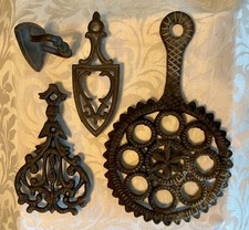Three 3 vintage cast iron trivets and cast iron mini iron