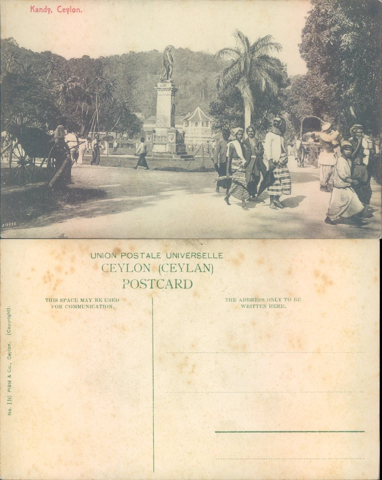 Street scene with statue in Kandy Ceylon Sri Lanka Plate Co People - Image 1 of 1