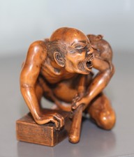 antique Japanese carved boxwood Okimono statue of a Rat catcher, 19th century.