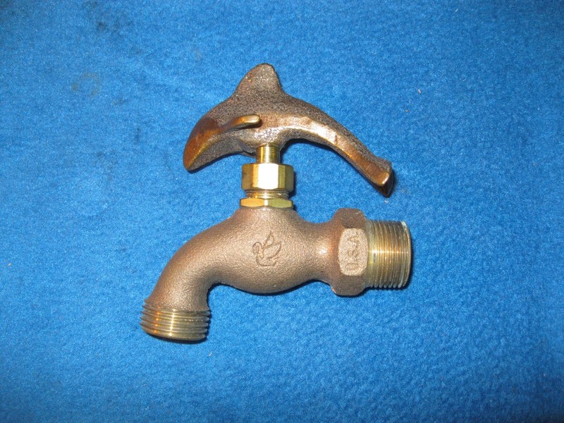 Brass Dolphin outside hose faucet spigot.  Made in the USA.  Unused.