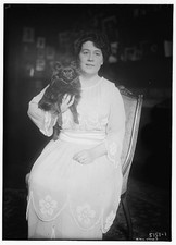 Carrara,women,pets,dog,animals,chairs,dresses,sleeves,portrait,Bain News