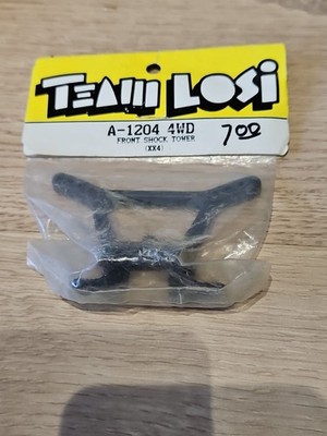 Team Losi XX4 Gen 1 Kunststoff Stoßdämpferbrücke vorne A-1204 Neu in Verpackung