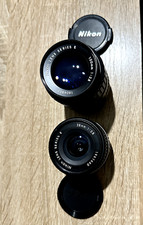 2 Objectifs Nikon Series E, 100mm 2,8 et 28mm 2,8, avec défauts