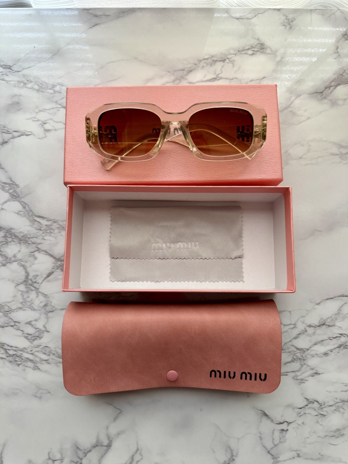 Miu Miu MU08ZS Sunglasses Transparent Sand Brown Frame Dark Brown Lenses