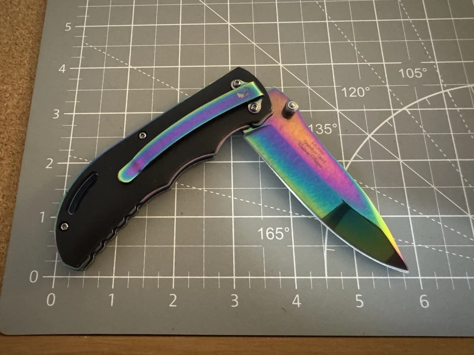 Cuchillo Plegable Cerrado Elk Ridge ER-A008 440C Arco Iris Titanio Camaleón Desvanecimiento 4.5" Foto 2 de 4