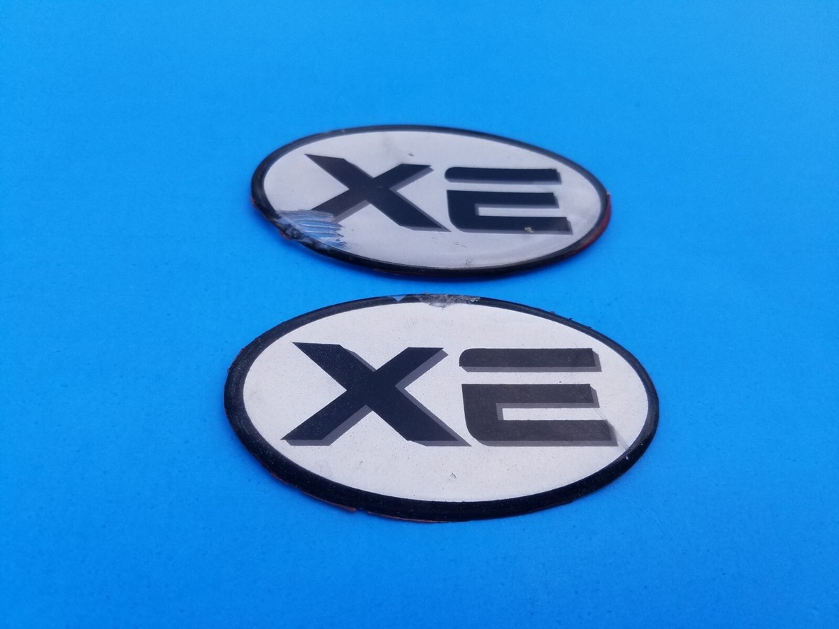 99 00 01 02 03 04 NISSAN FRONTIER XE SIDE EMBLEM BADGE