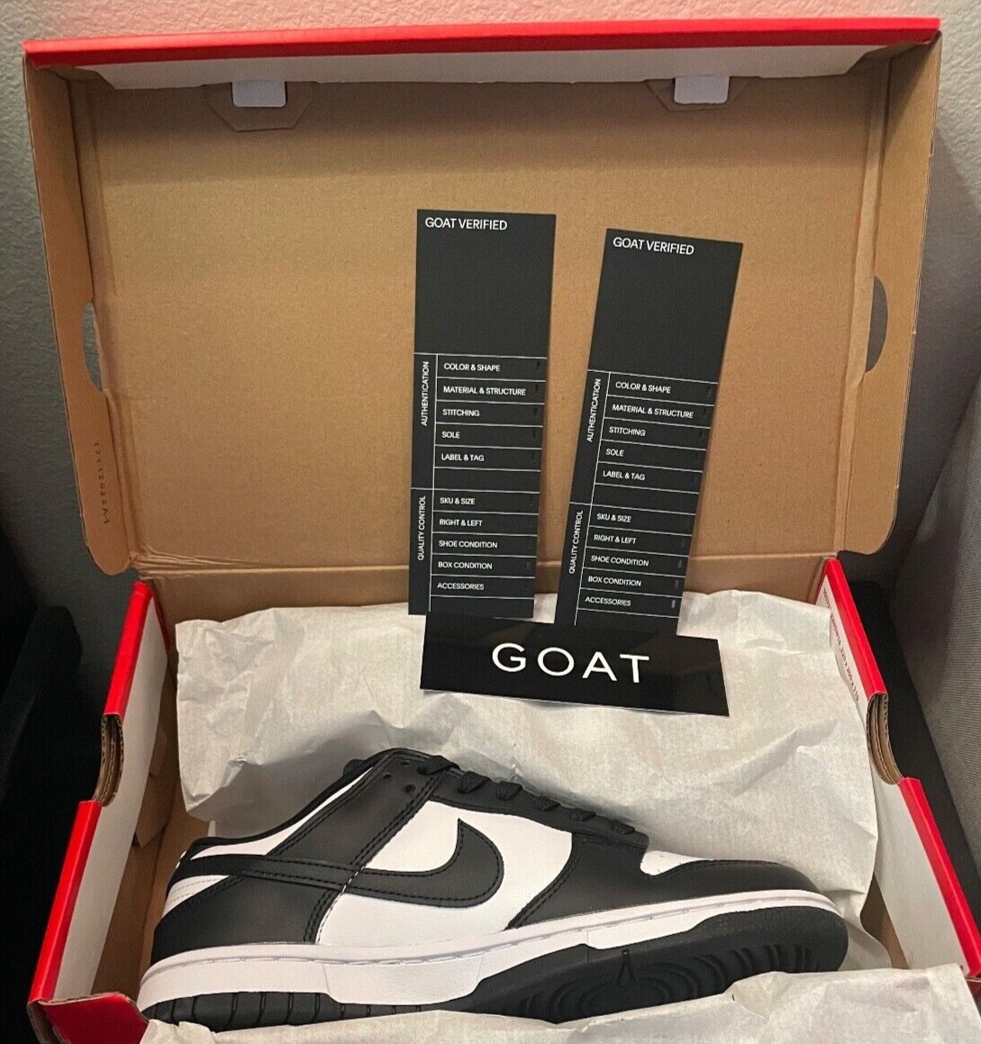 goat nike dunk low black and white