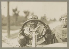 Champion Jack Johnson at wheel of 90 horse power Thomas Flyer,c1910,Boxer