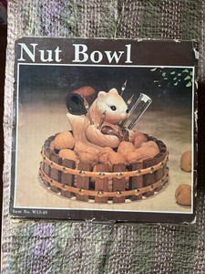 Vintage wooden nut bowl, #W13-49. features a ceramic squirrel with nut crackers.