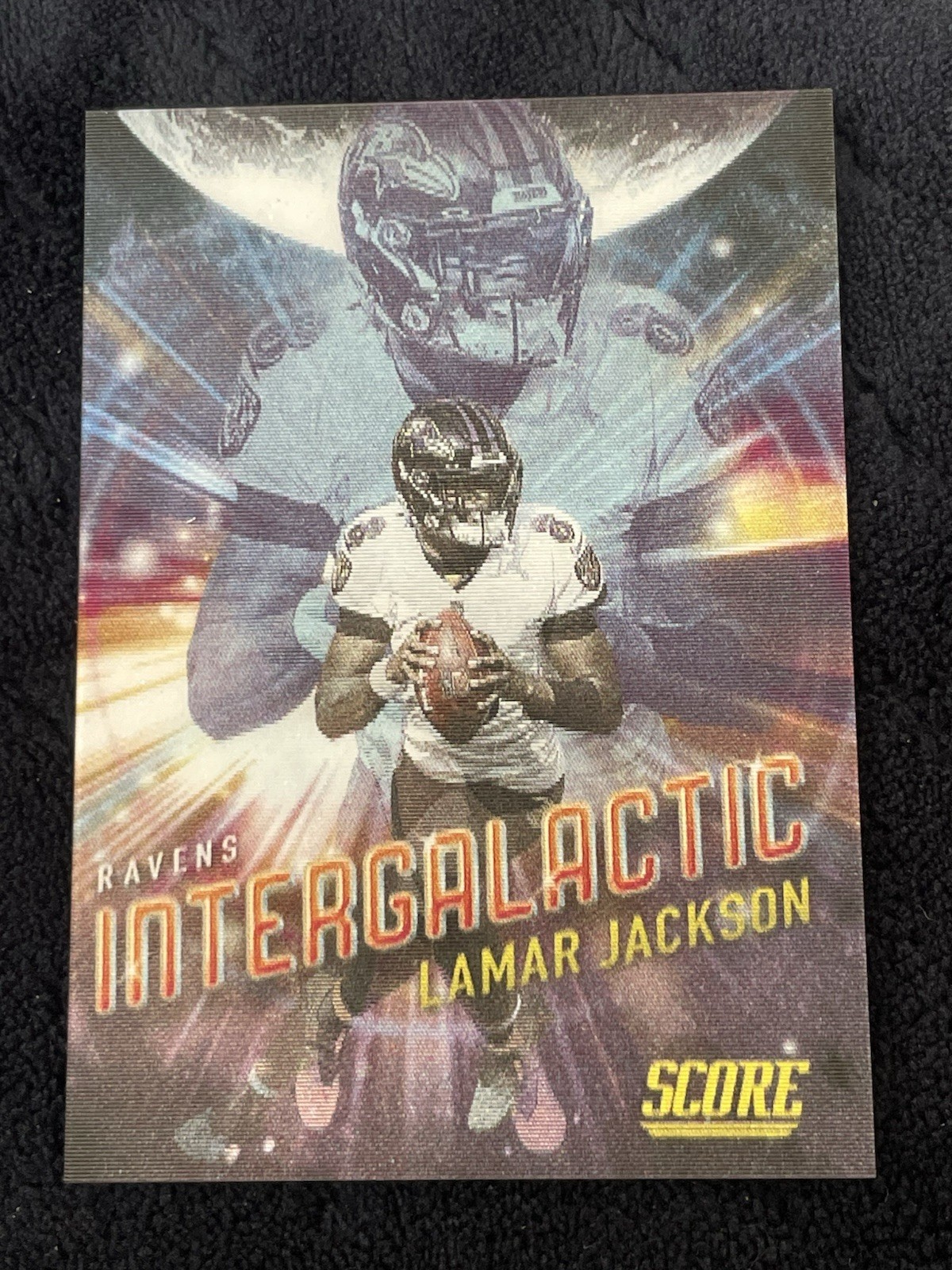2021 Panini Score Lamar Jackson Intergalactic Case Hit #I10