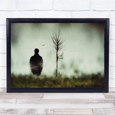 man by dead tree landscape Wall Art Print