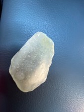 sea glass gray jade, 2 quarters, chipped, and a little dirty also has a bubble