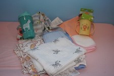 New and used swaddles, sippy cups, Boppy nursing pillow cover, burp cloths, etc.