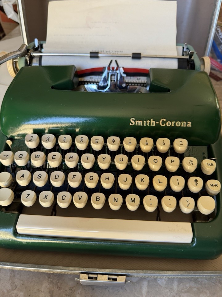 A 1957 Smith Corona Sterling in rare forest army green, professionally cleaned and serviced — a museum-quality daily driver.