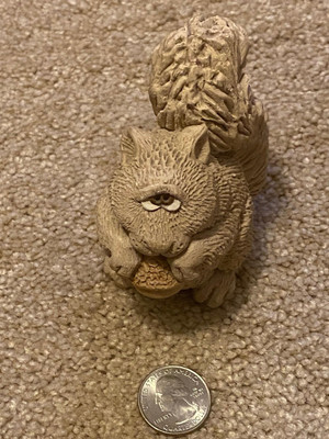 Super cute chalkware or clay sitting squirrel with acorn - cute and sad eyes!