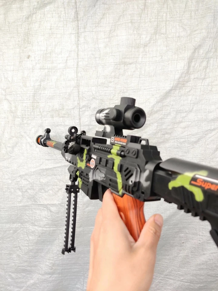 Ametralladora de regalo de juguete 100 unidades con mira de luz bala rifle de asalto militar Foto 3 de 4