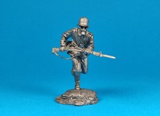Tin miniature A German infantryman goes on an assault wearing a gas mask