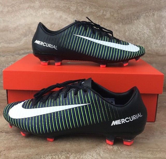 white and green nike cleats