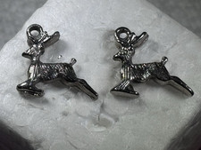 TWO VINTAGE SILVER TONE LEAPING REINDEER STAGS CHARMS OR PENDANTS NO MARK