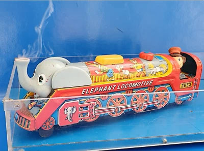 JOUET ANCIEN RARE ÉLÉPHANT LOCOMOTIVE À VAPEUR AVEC FUMÉE ET BRUITAGE ANNÉES 60 - Photo 1/4