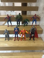 collection of classic Marvel and DC action figures X8