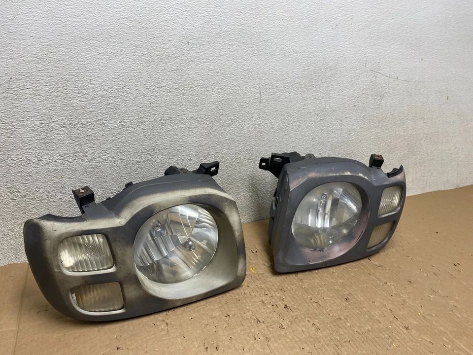 Faros laterales izquierdo+derecho Nissan Xterra 2002 2003 2004 OEM T7660 DW Foto 2 de 4