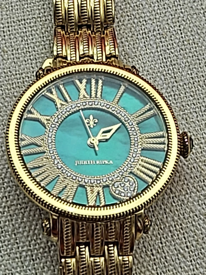 Reloj Judith Ripka London tono dorado verde. Batería nueva. Foto 2 de 4