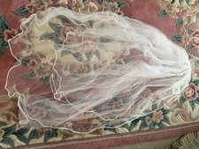 David’s Bridal Wedding Accessories ft. a white lace veil, tiara and a slip